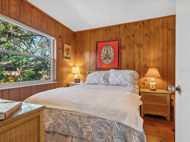 bedroom with wood walls