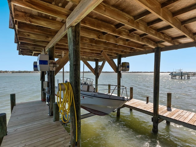 dock area featuring a water view and boat lift