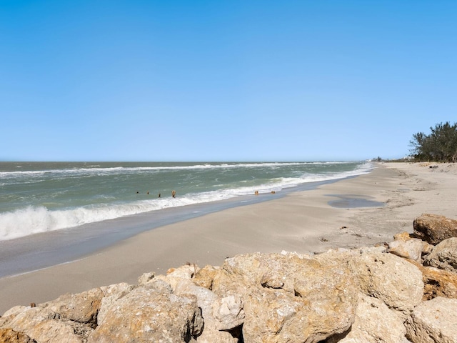 property view of water featuring a beach view