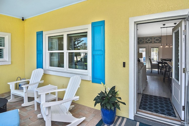 entrance to property featuring stucco siding