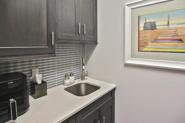 kitchen featuring a sink and backsplash