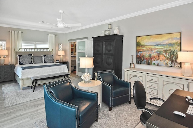 bedroom featuring ceiling fan, visible vents, ornamental molding, and light wood-style flooring