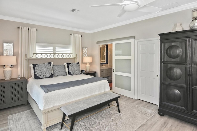 bedroom featuring ceiling fan, visible vents, light wood-style flooring, and crown molding