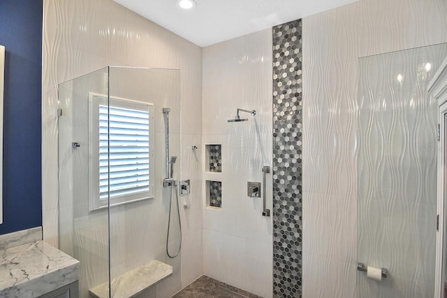 bathroom featuring tiled shower