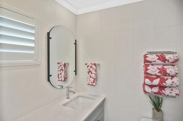 bathroom featuring ornamental molding and vanity