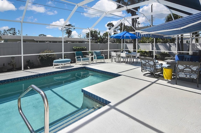 view of pool featuring a fenced in pool, glass enclosure, a patio, and fence