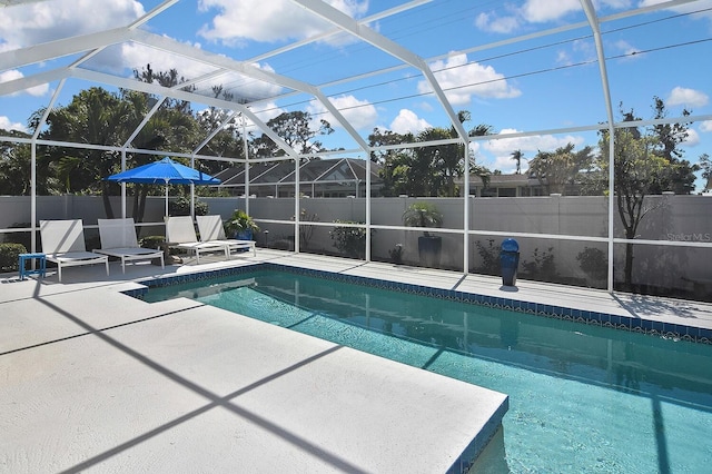 view of pool with a patio, a fenced in pool, fence, and a lanai