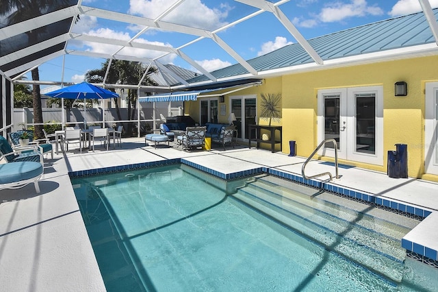 view of swimming pool featuring a fenced in pool, fence, glass enclosure, french doors, and a patio area