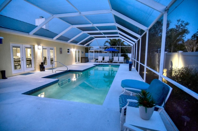 view of pool with a patio area, a fenced in pool, french doors, and a fenced backyard