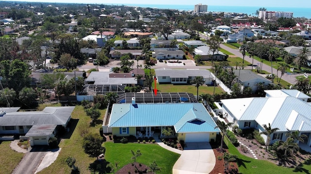 birds eye view of property featuring a residential view and a water view