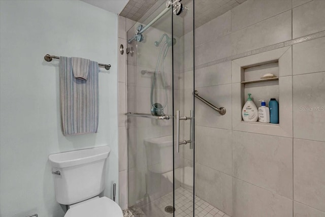 full bath with toilet and a shower stall