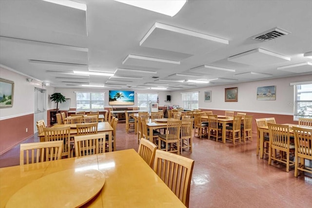 dining room featuring visible vents