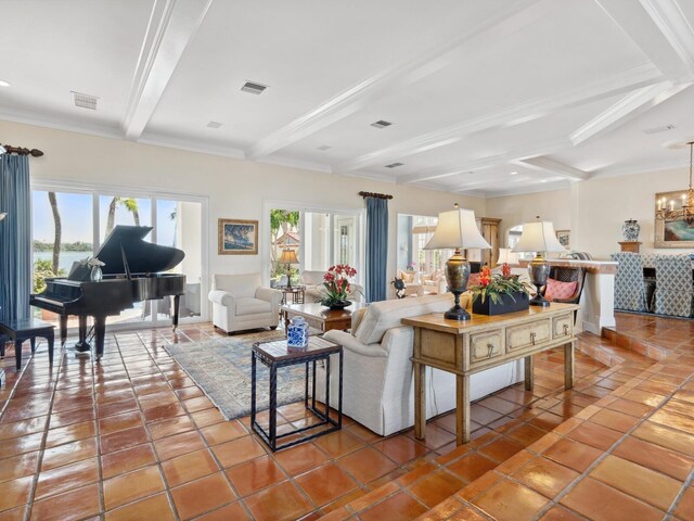 living room featuring visible vents, beam ceiling, and plenty of natural light