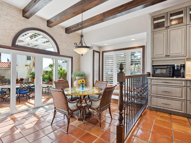 dining space featuring recessed lighting, a high ceiling, beam ceiling, and light tile patterned flooring