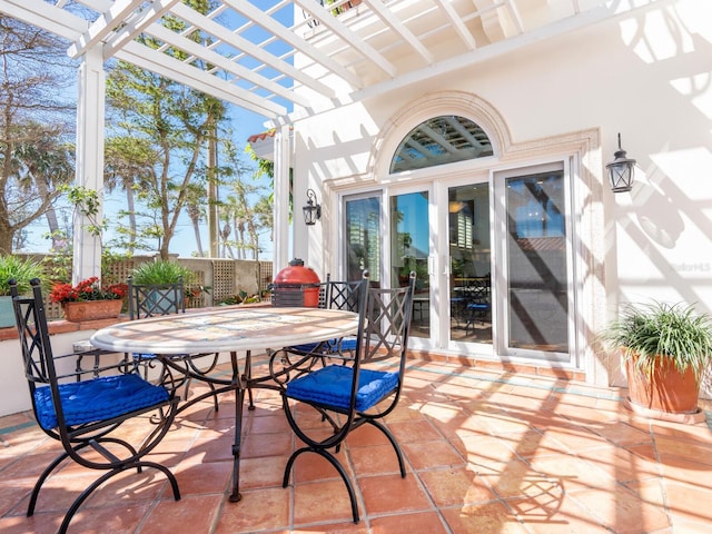 view of patio / terrace featuring outdoor dining area and a pergola