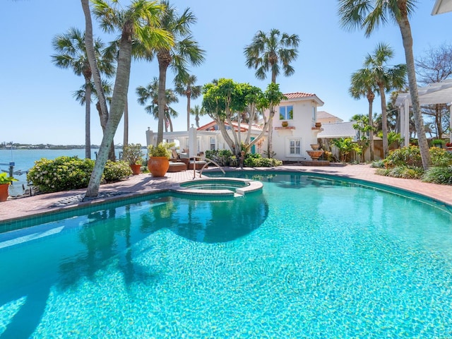view of pool featuring a pool with connected hot tub