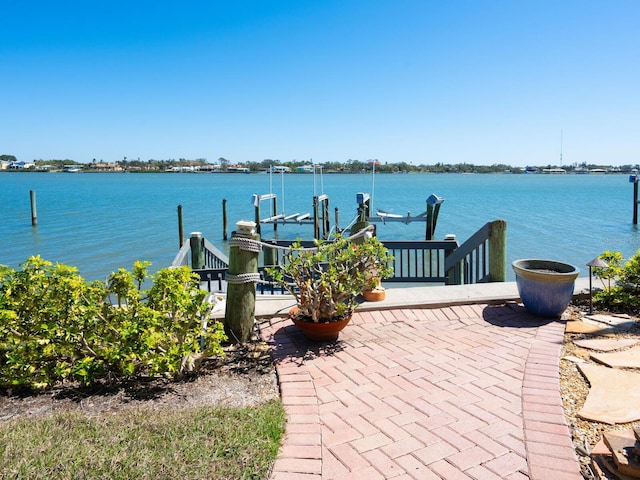 view of dock featuring a water view and boat lift