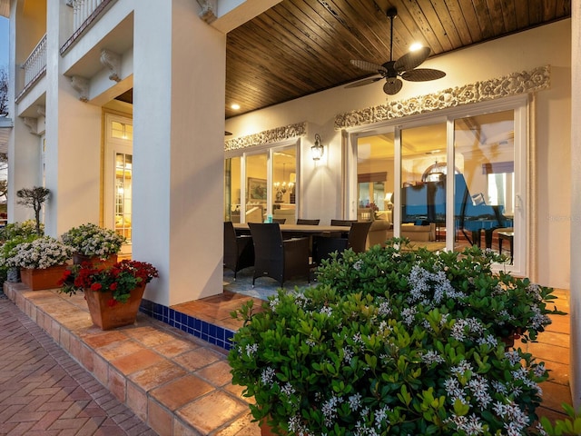 exterior space with ceiling fan