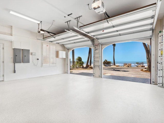 garage featuring electric panel and a garage door opener