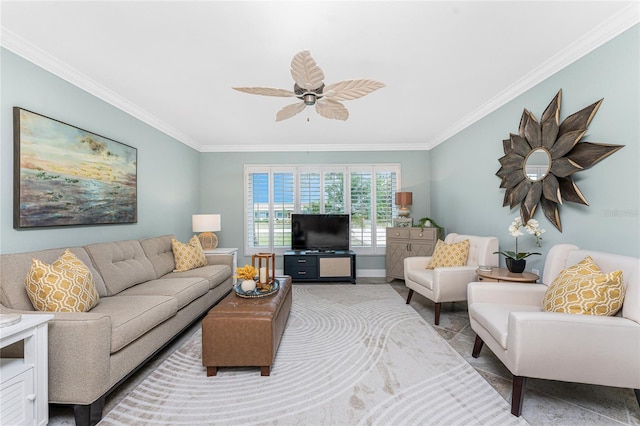 living room with crown molding, a ceiling fan, and baseboards