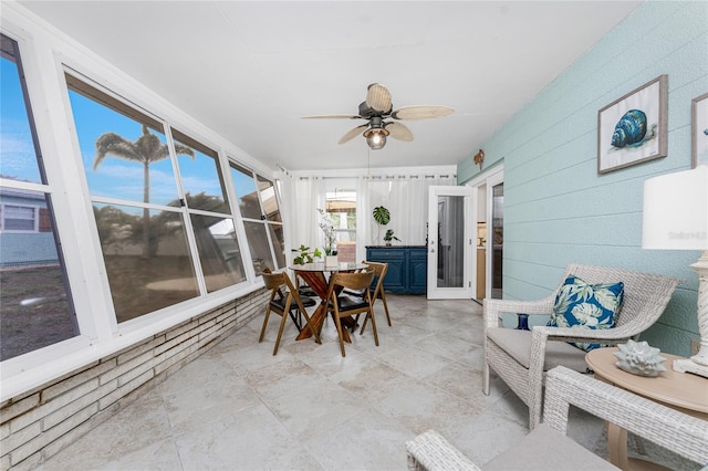 sunroom with a ceiling fan