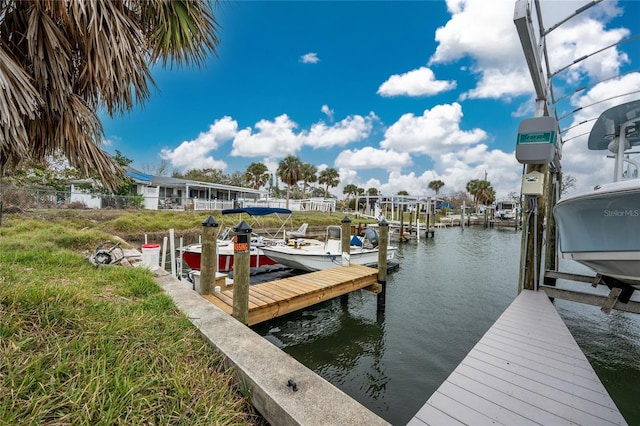 view of dock with a water view and boat lift