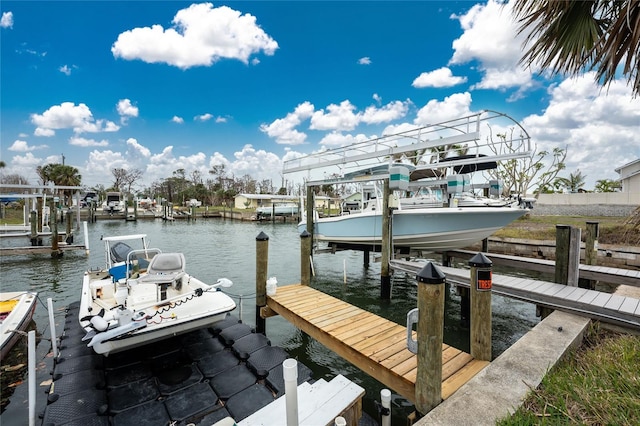 dock area featuring a water view and boat lift