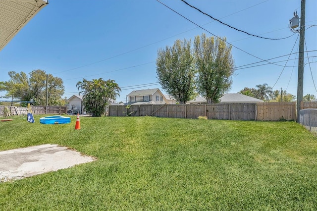 view of yard with a fenced backyard