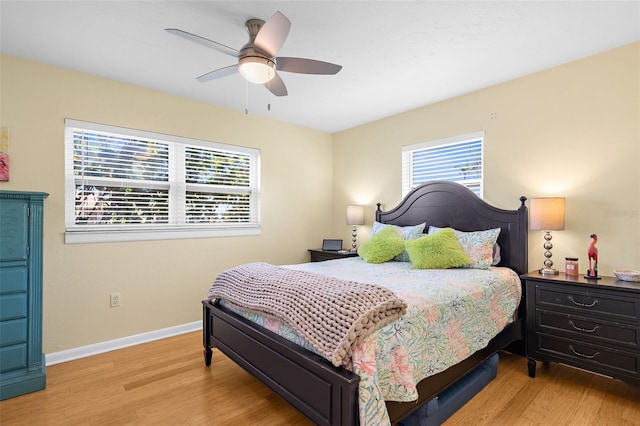 201 Cavallini Dr, Nokomis, FL 34275 - bedroom with baseboards, light wood-type flooring, and a ceiling fan