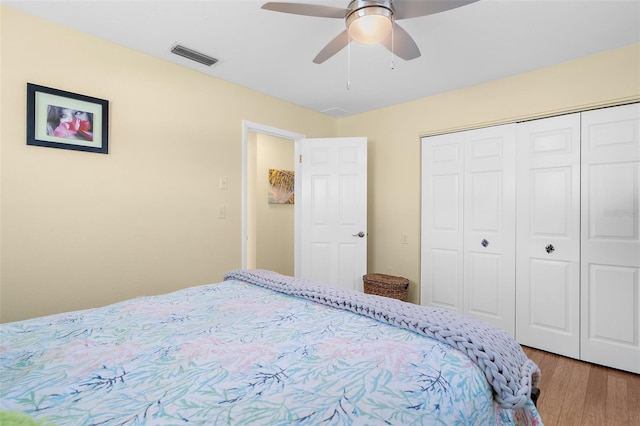 201 Cavallini Dr, Nokomis, FL 34275 - bedroom with a ceiling fan, wood finished floors, a closet, and visible vents