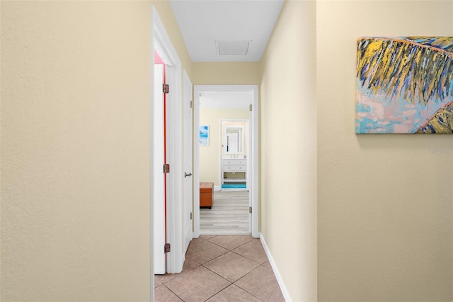 201 Cavallini Dr, Nokomis, FL 34275 - corridor featuring light tile patterned flooring and baseboards