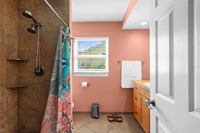201 Cavallini Dr, Nokomis, FL 34275 - full bathroom with vanity, baseboards, tile patterned floors, and tiled shower