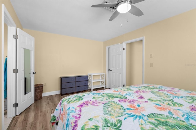 201 Cavallini Dr, Nokomis, FL 34275 - bedroom featuring baseboards, ceiling fan, and wood finished floors