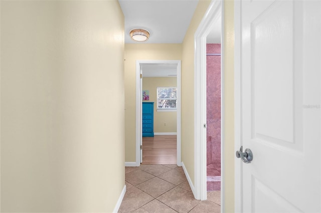 201 Cavallini Dr, Nokomis, FL 34275 - corridor featuring light tile patterned flooring and baseboards