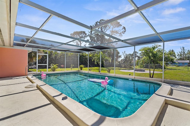 201 Cavallini Dr, Nokomis, FL 34275 - outdoor pool featuring a lawn, glass enclosure, and a patio area