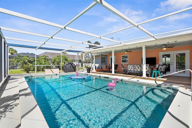201 Cavallini Dr, Nokomis, FL 34275 - outdoor pool with ceiling fan, a lanai, a patio area, and french doors