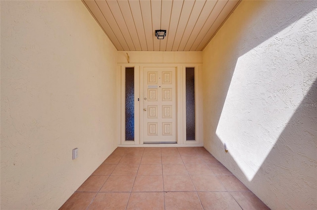 entrance to property with stucco siding