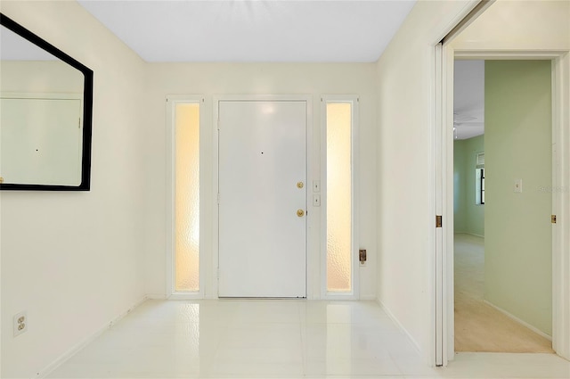 entryway featuring baseboards