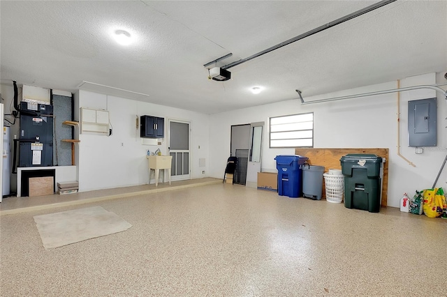 garage featuring electric panel, water heater, a garage door opener, heating unit, and a sink