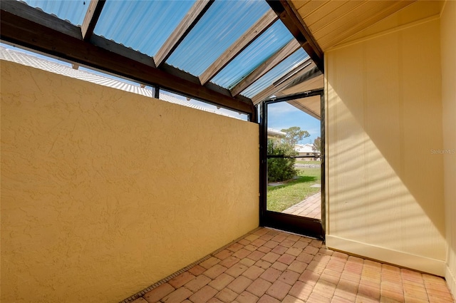 view of patio with glass enclosure