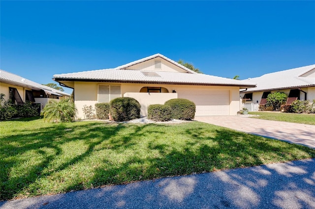 ranch-style home with a front lawn, a tile roof, stucco siding, driveway, and an attached garage