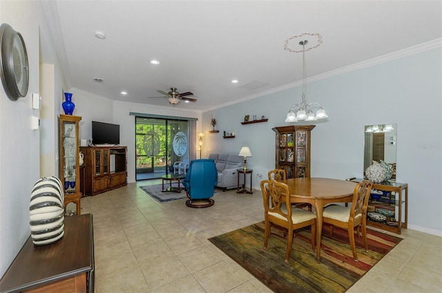 dining room featuring light tile patterned floors, visible vents, crown molding, and ceiling fan with notable chandelier