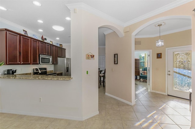 kitchen featuring crown molding, light stone countertops, light tile patterned floors, arched walkways, and stainless steel appliances