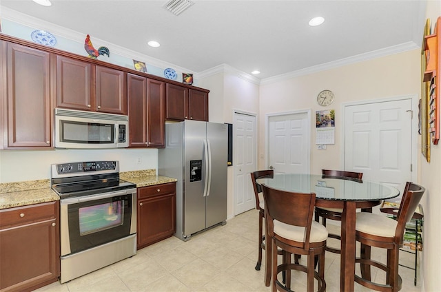 kitchen with visible vents, stainless steel appliances, crown molding, and light stone countertops