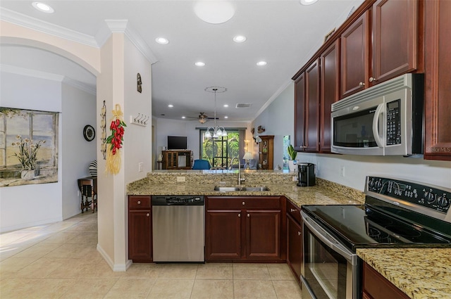 kitchen with crown molding, light stone countertops, appliances with stainless steel finishes, and a sink