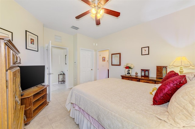 bedroom featuring light tile patterned floors, a ceiling fan, and visible vents