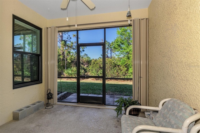 sunroom / solarium with ceiling fan