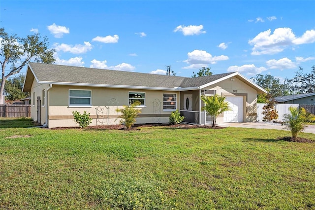 ranch-style home featuring stucco siding, a front yard, an attached garage, and fence