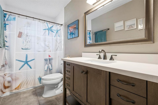 bathroom featuring vanity, a shower with curtain, a textured ceiling, tile patterned floors, and toilet