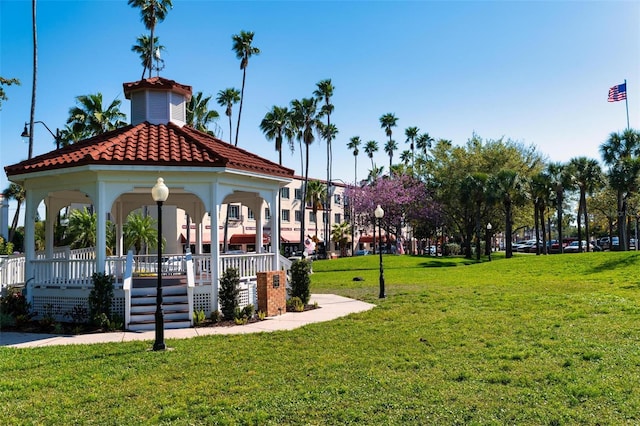 surrounding community with a gazebo and a yard